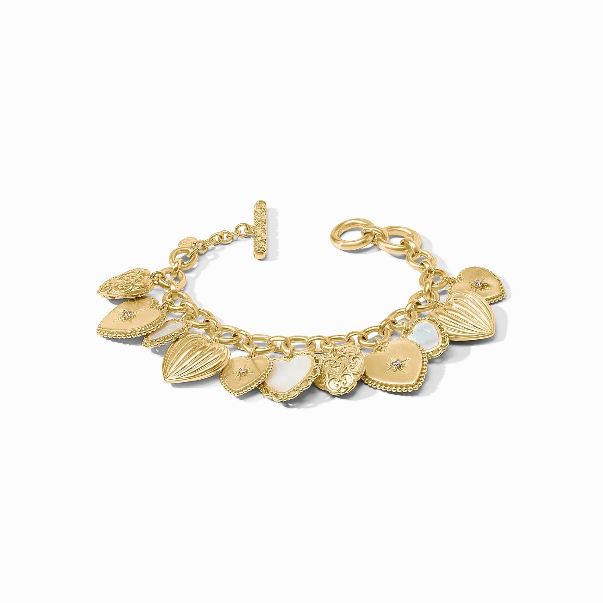 Gold heart charm bracelet with mother of pearl and CZ accents, featuring a toggle closure.
