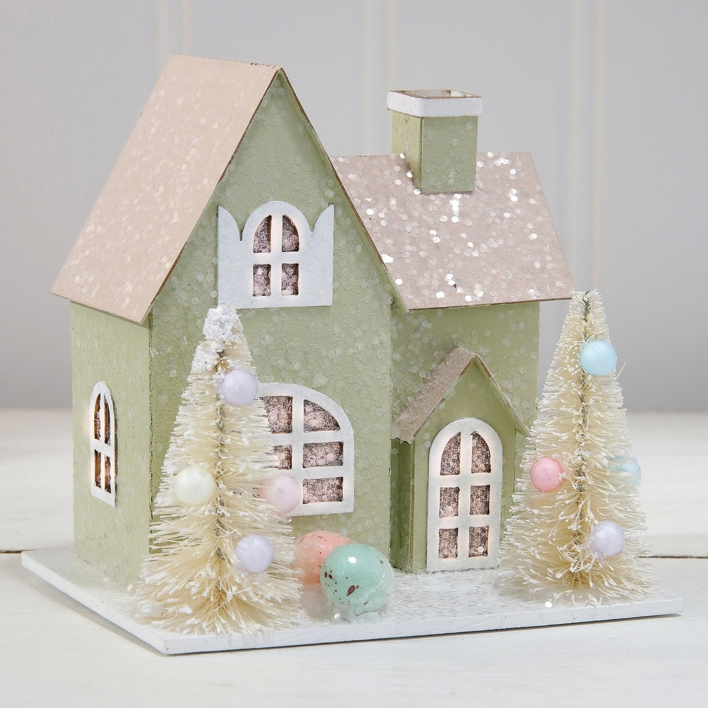 3.75-inch cardboard Easter house with sugared finish, LED lights, and spring tree patterns.