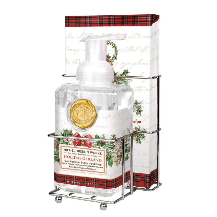Foaming hand soap dispenser with matching napkin holder set in neutral tones.