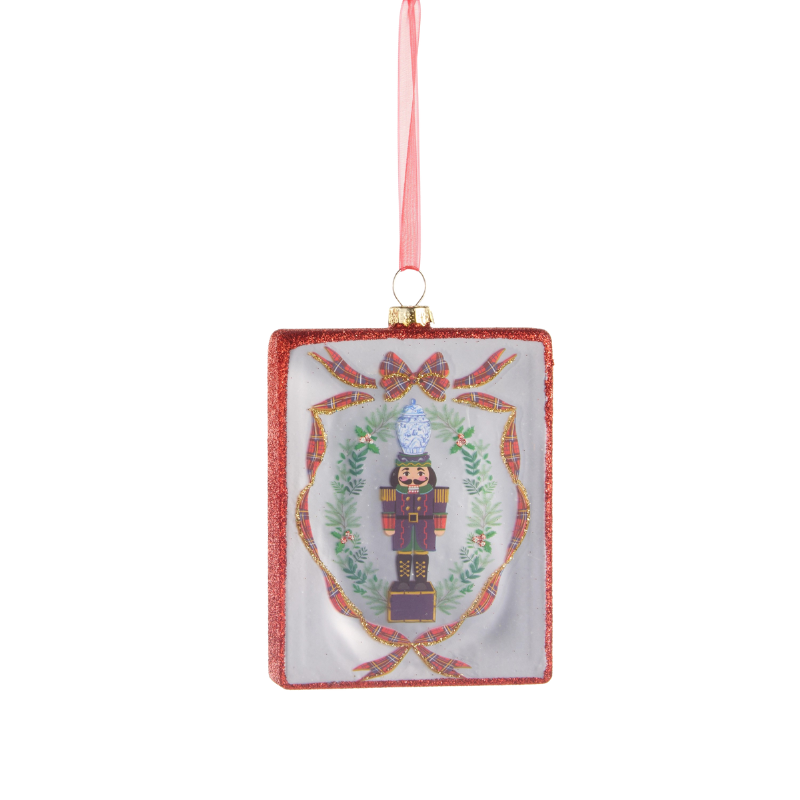 4.5-inch glass rectangle ornament featuring a nutcracker illustration with a red glitter border.