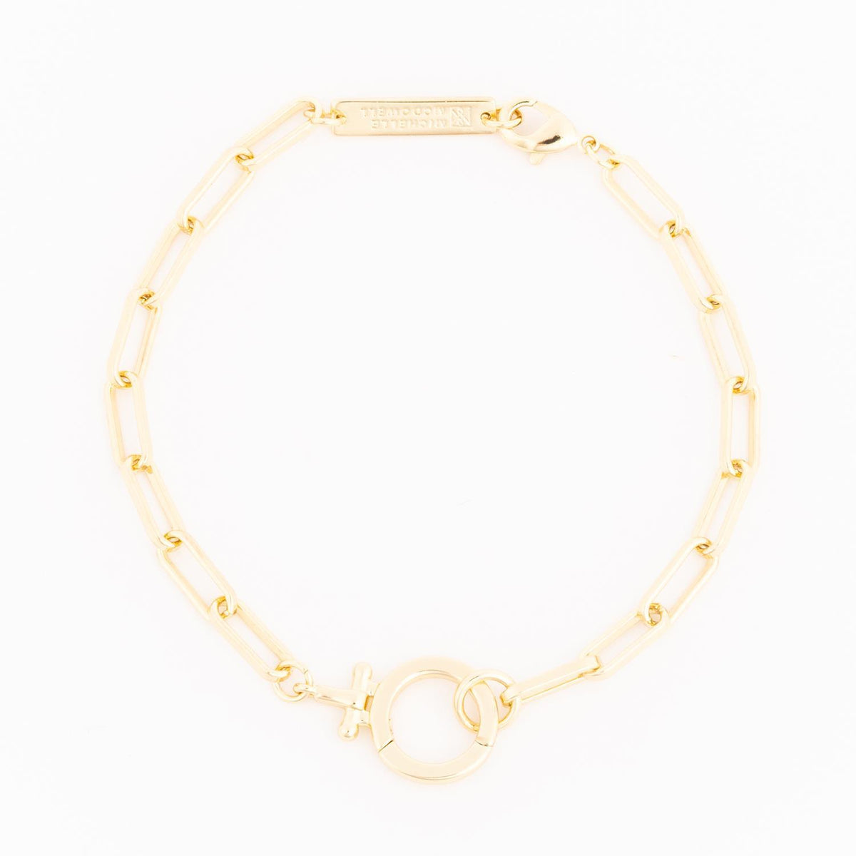 Gold Thea bracelet featuring a delicate chain with an oval pendant.