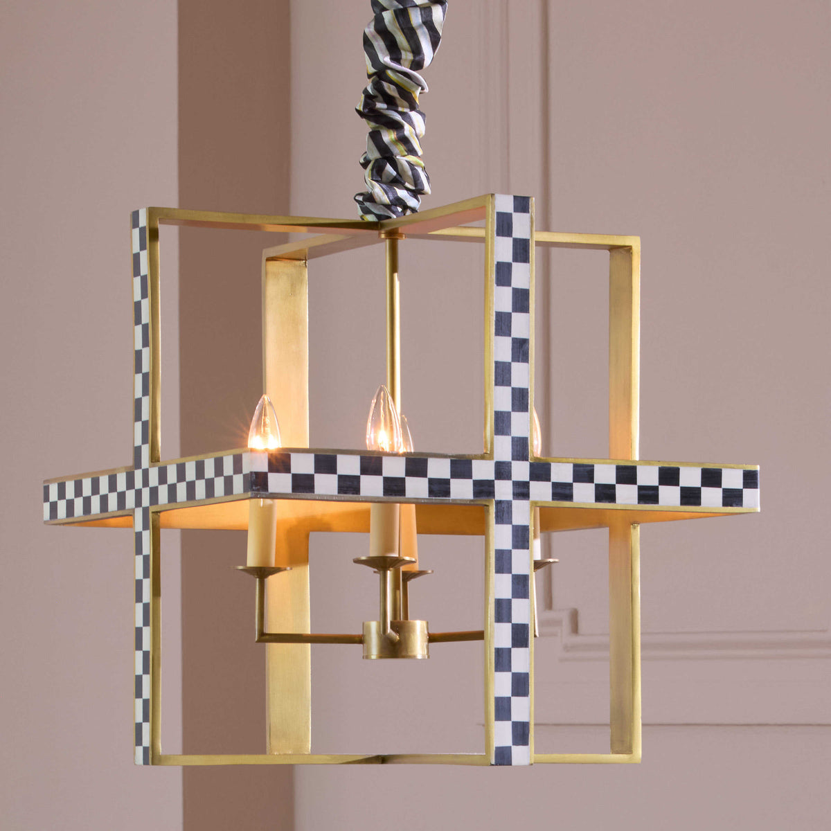 Cast aluminum chandelier with alternating black and white resin inlay candelabra bulbs