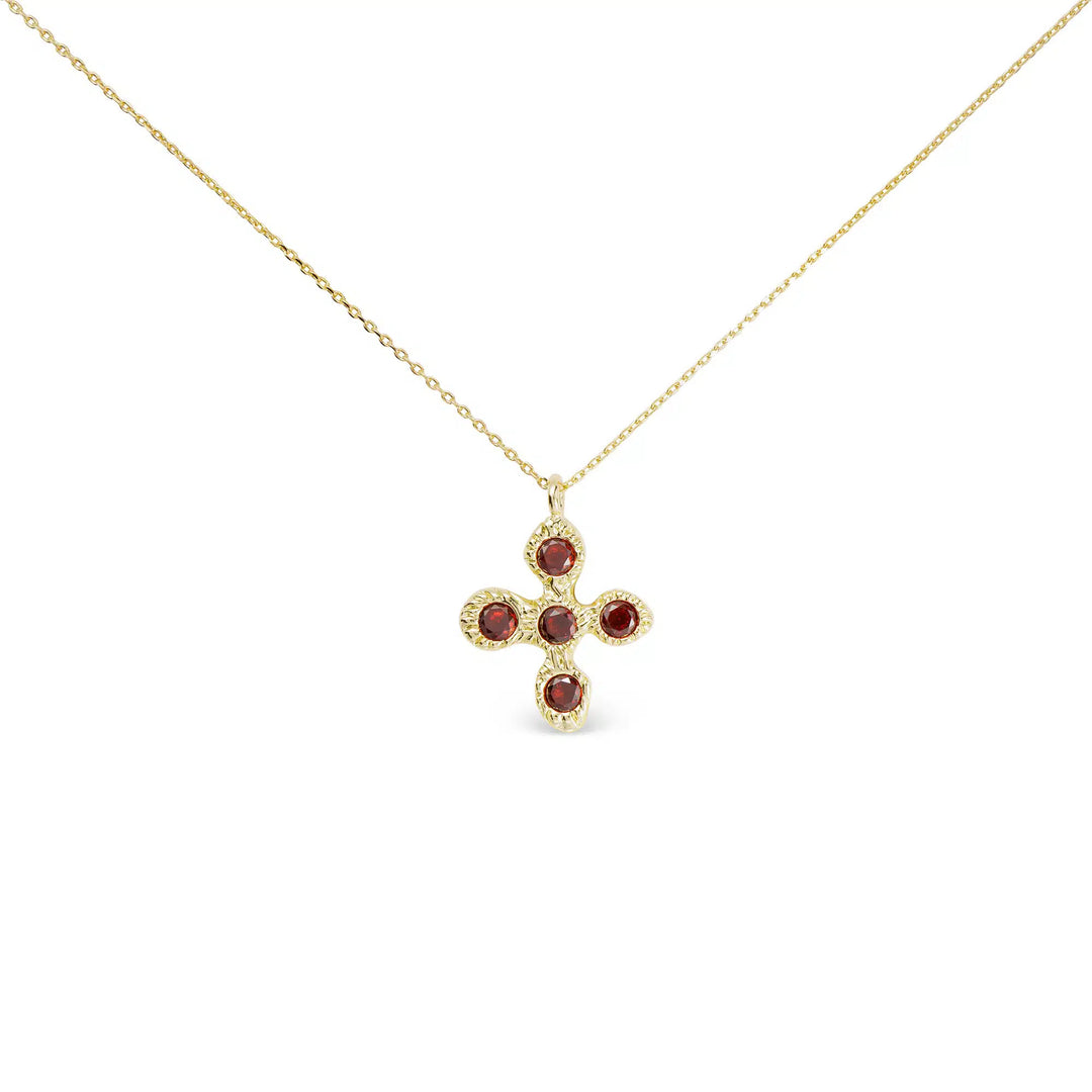 Gold cross necklace featuring five round red CZ stones on a delicate gold chain.