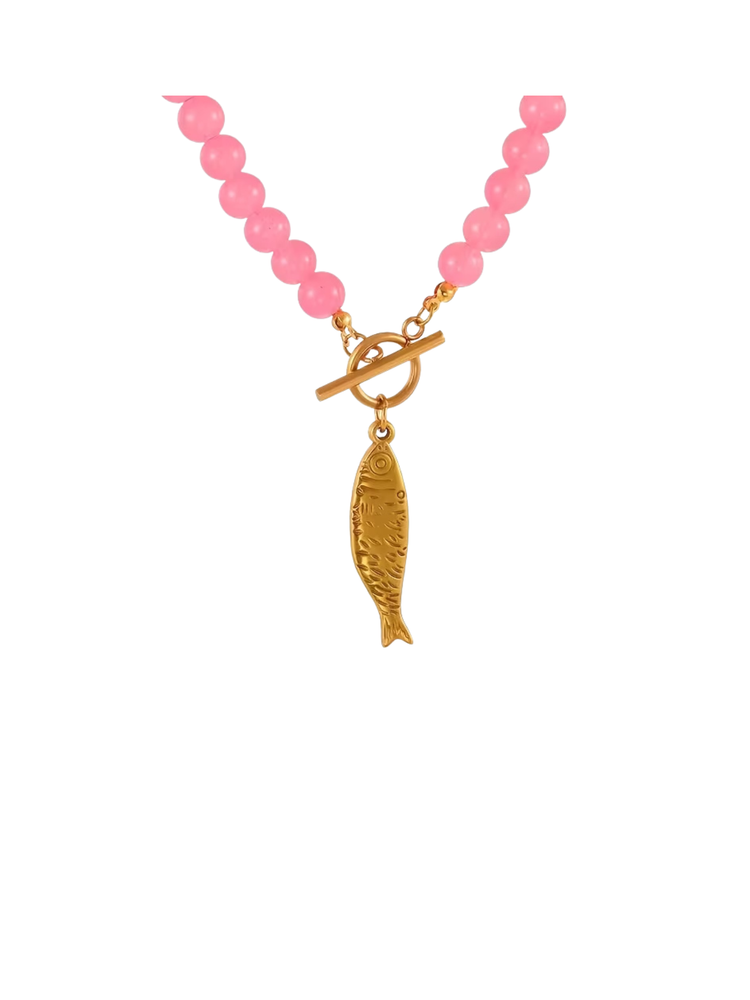 Pink beaded necklace with a gold-tone toggle clasp and a textured fish pendant.
