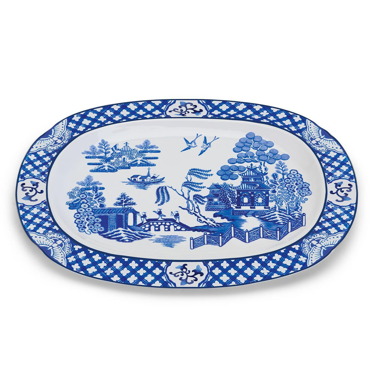 Oval porcelain Blue Willow serving platter with traditional blue and white landscape design.
