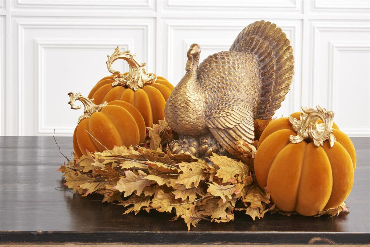 9.5 inch orange velvet pumpkin with a gold filigree stem in a Thanksgiving centerpiece.