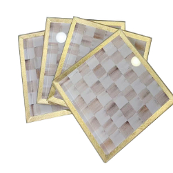 Set of four square glass coasters with a mocha and white checkered pattern and gold-toned borders.