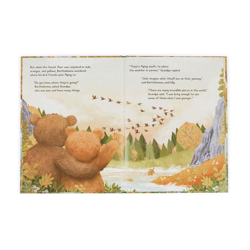 Open pages of It's a Big World Bartholomew book showing two bears watching birds fly south.
