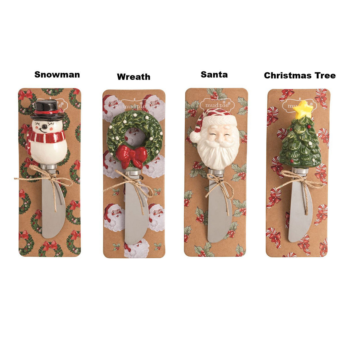 Four Christmas spreaders with snowman, wreath, Santa, and tree stoneware handles on display cards.