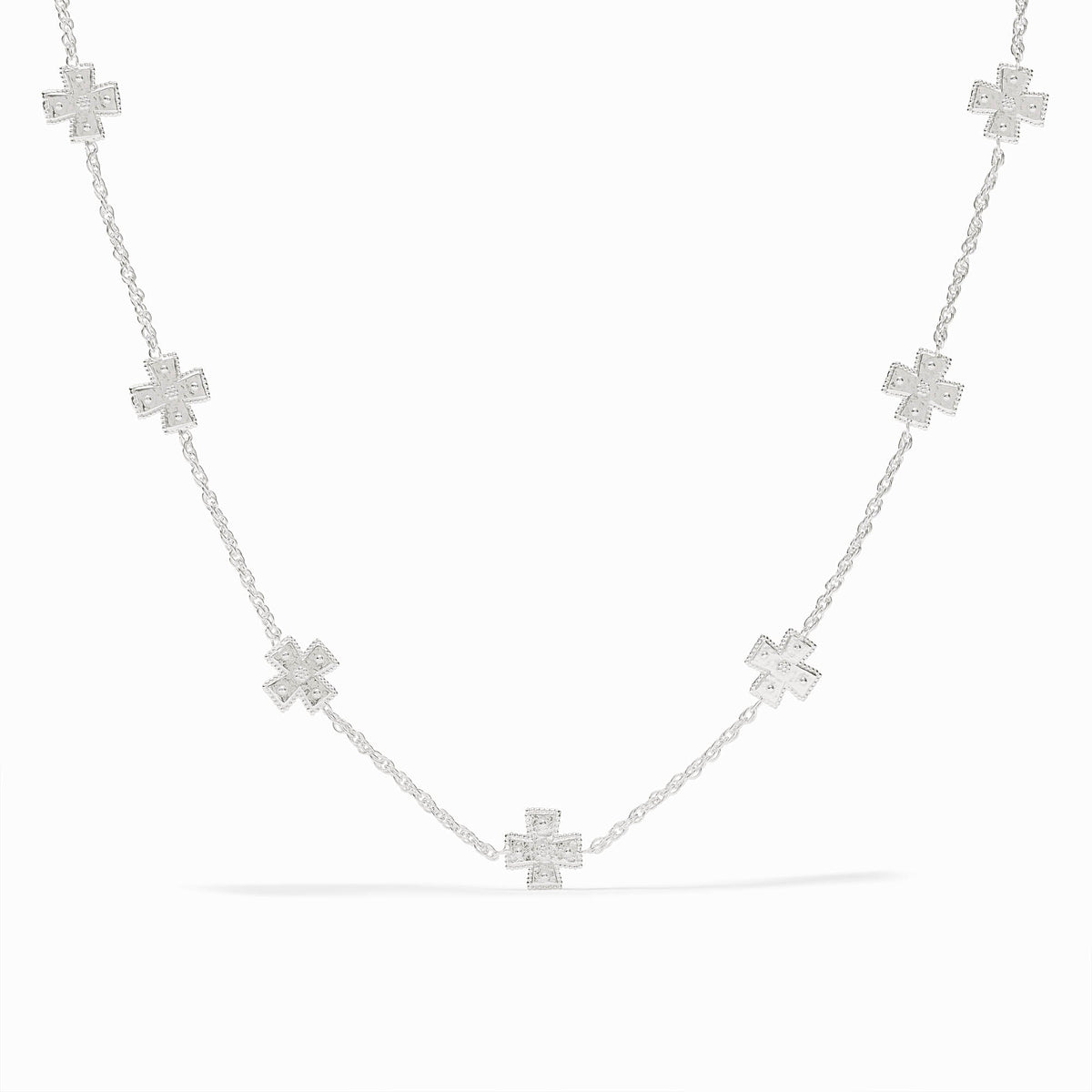 Canterbury Delicate Station Necklace in silver featuring seven small cross charms on a fine chain.