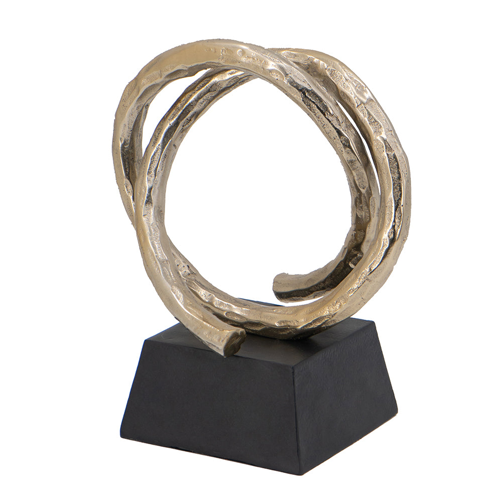 Entwined Sculpture: aluminum decorative piece with interlocking curved forms in a neutral metallic finish.
