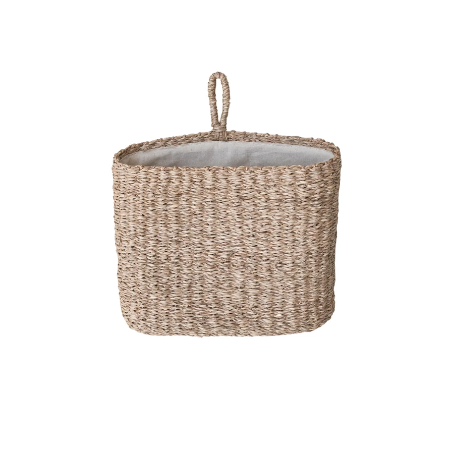 Hand-woven seagrass wall basket with cotton lining in natural beige tones