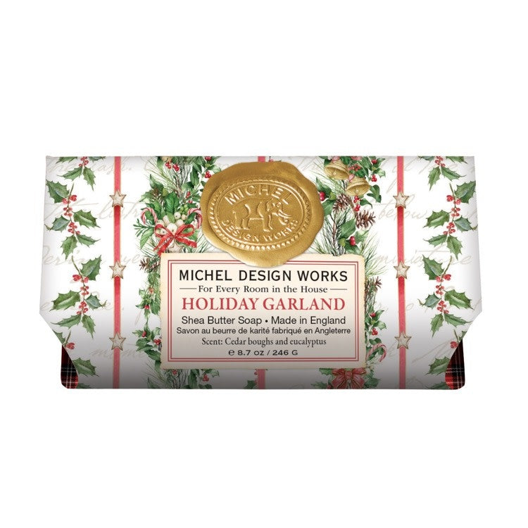 Large bath soap bar with a holiday garland leaf and berry pattern in green tones.