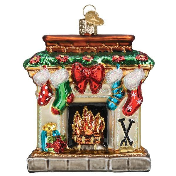 Red glass ornament shaped like a fireplace with gold accents.