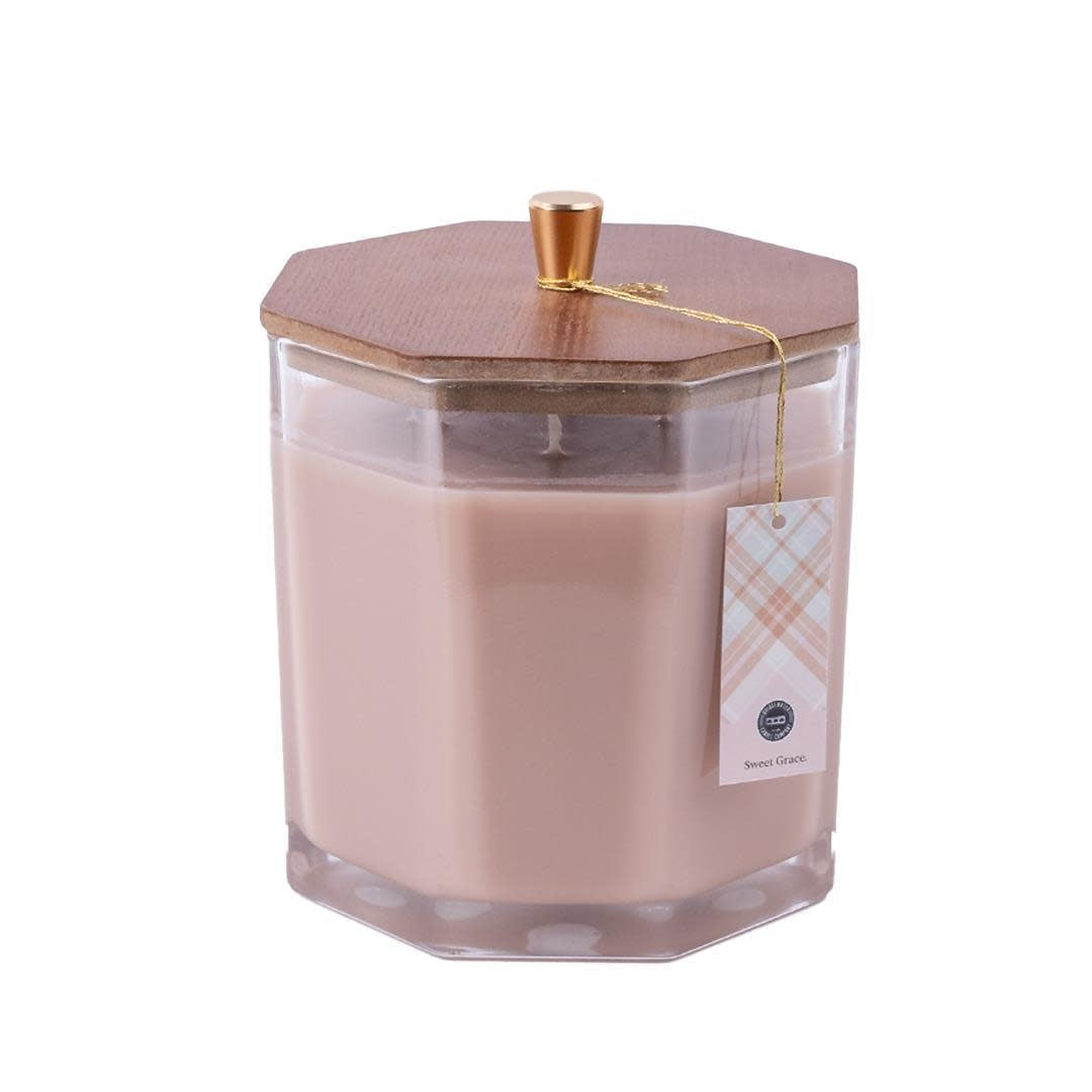 Large black soy-blend candle in a clear glass vessel with Sweet Grace fragrance notes.