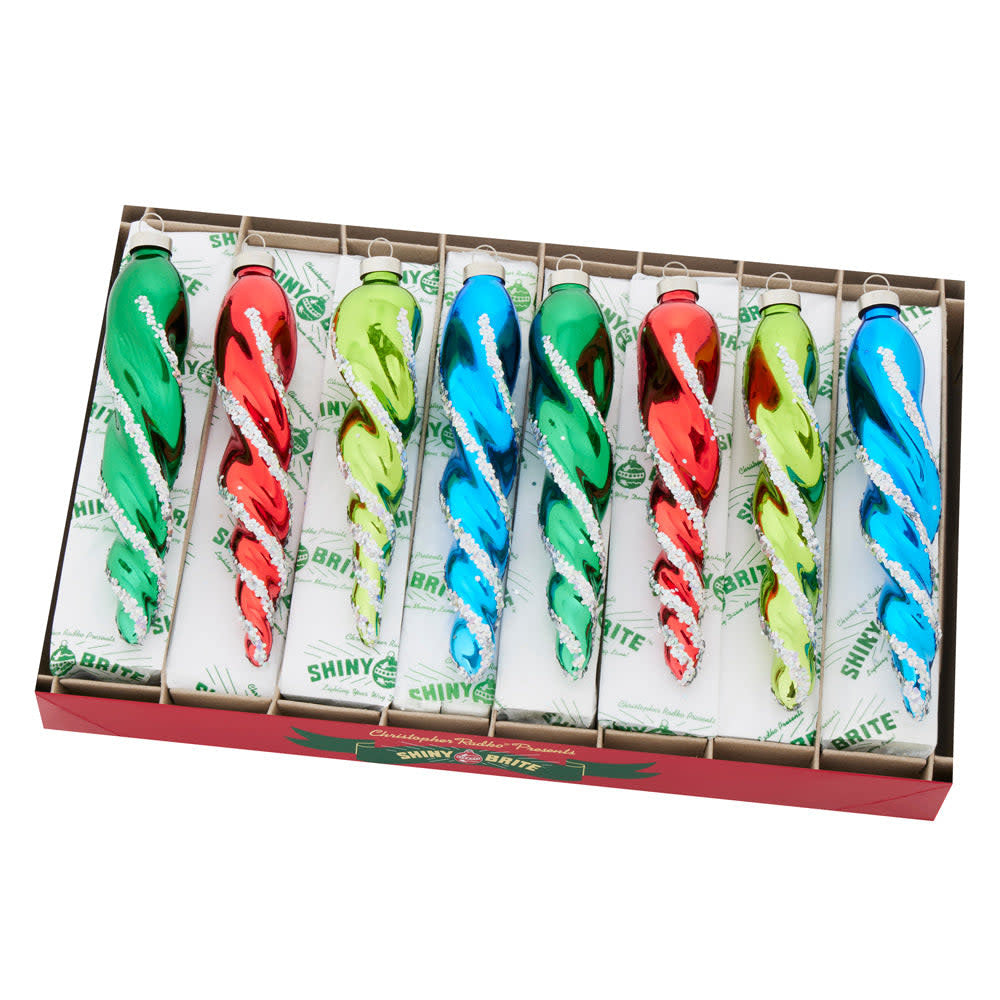 Eight clear glass icicle ornaments with a festive holiday splendor pattern hanging from hooks.
