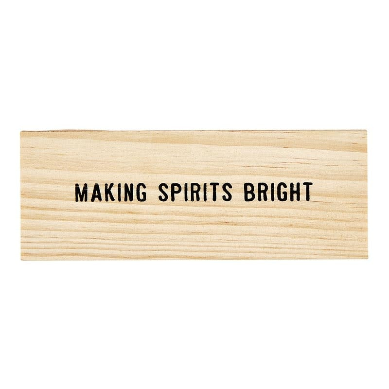 Holiday wine charms in a decorative wooden box featuring spirits bright designs made with wood and metal accents.
