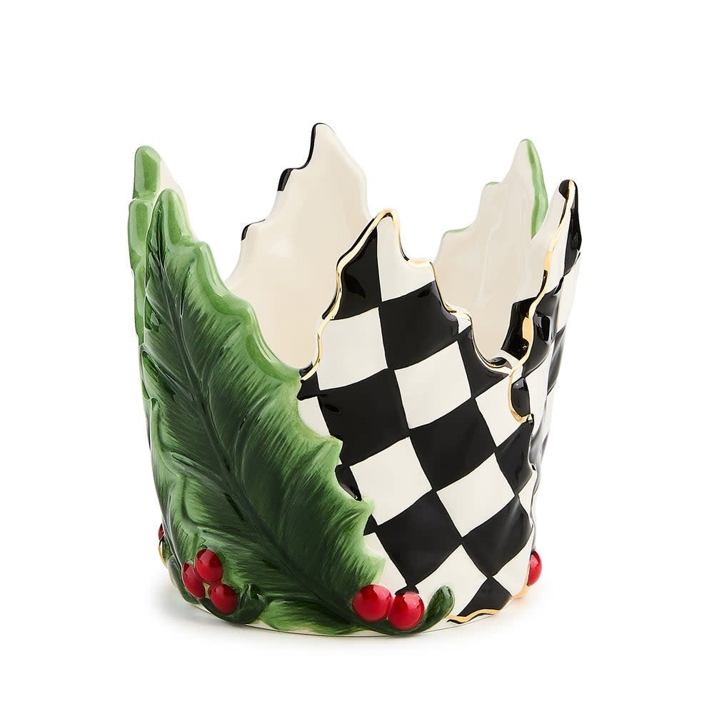 Short ceramic candle holder with green holly leaf relief pattern.
