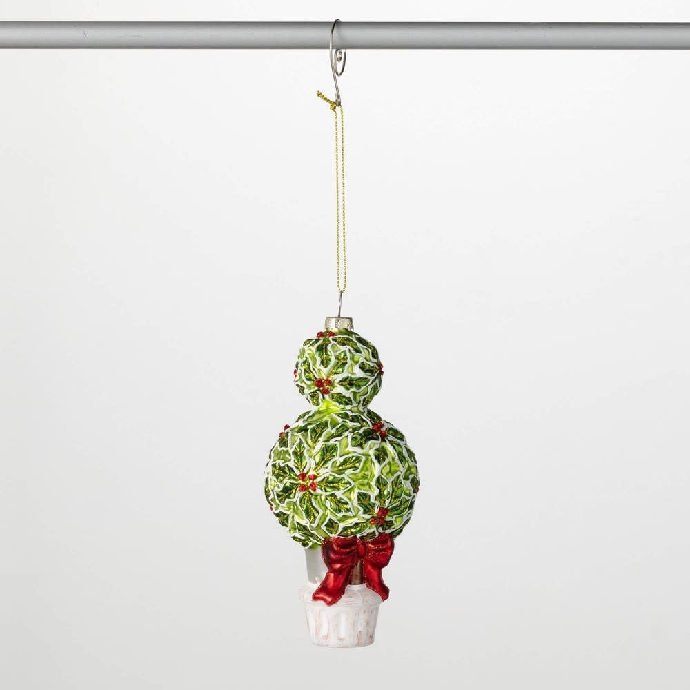 Glass holly ornament with green leaves and red berries on a silver hook