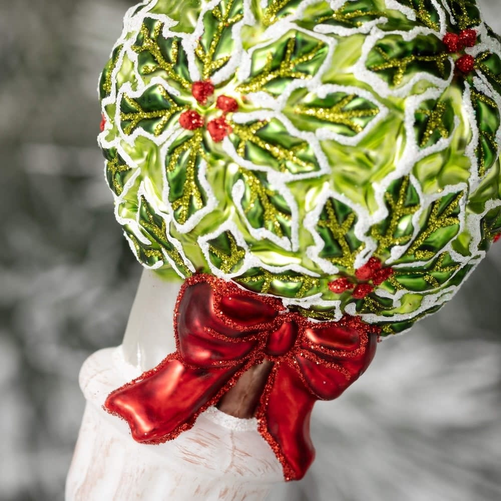 Glass holly ornament with green leaves and red berries on a silver hook