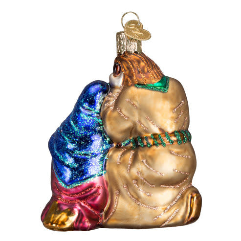 Holy Family ornament featuring Mary, Joseph, baby Jesus in a manger, with a shining star against a dark background.