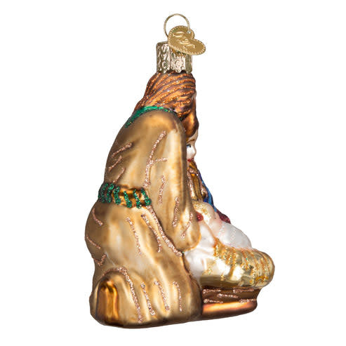 Side view of a Holy Family ornament featuring Mary, Joseph, baby Jesus in a manger, and a shining star.