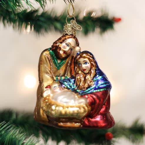 Resin Holy Family ornament featuring Mary, Joseph, baby Jesus in a manger, and the star.