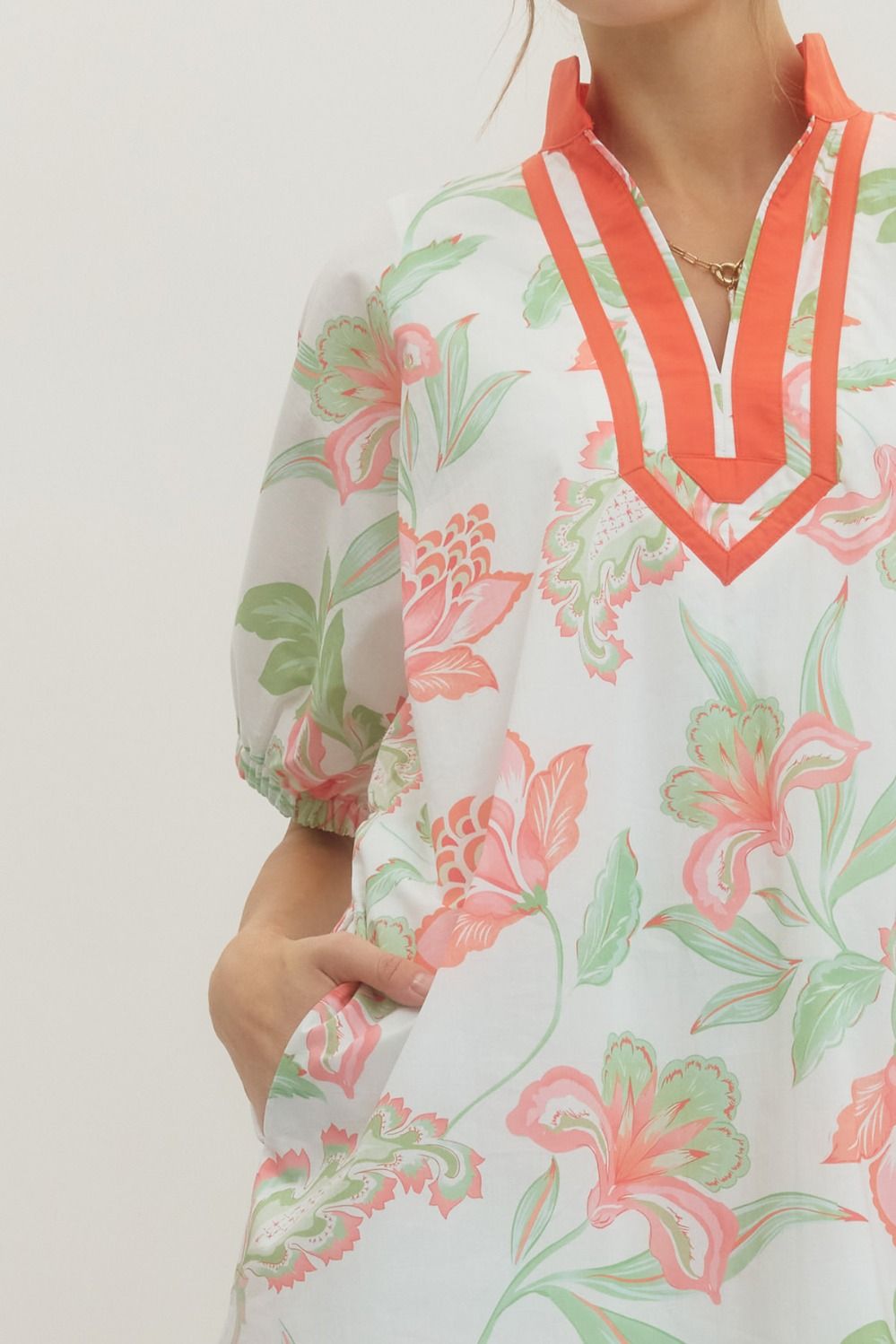 Ella floral print cotton mini dress with puff sleeves, contrast band collar V-neck, and side pockets.
