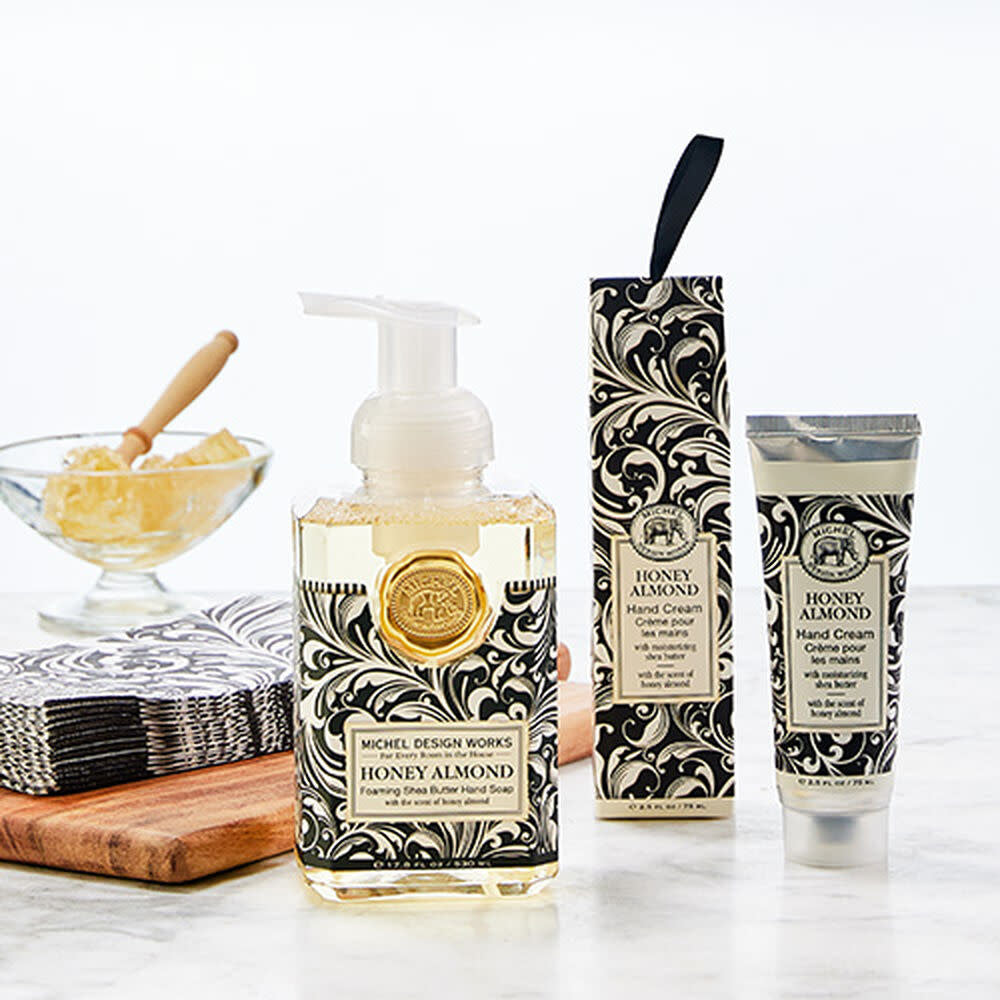 Hostess Gift Set featuring honey almond foaming hand soap, large moisturizing cream with shea butter and aloe, plus triple-ply napkins.