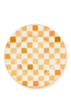 Round honey-colored stoneware platter with a checkered pattern