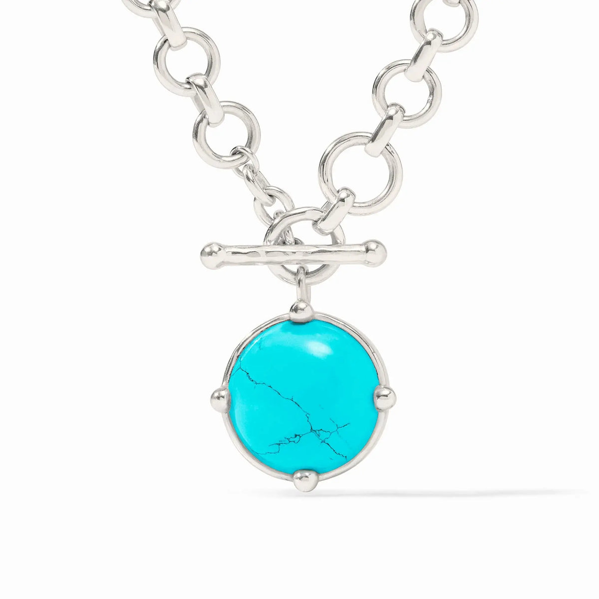 Silver demi necklace with turquoise rose-cut stone pendant featuring a bas-relief bee detail and adjustable chain.