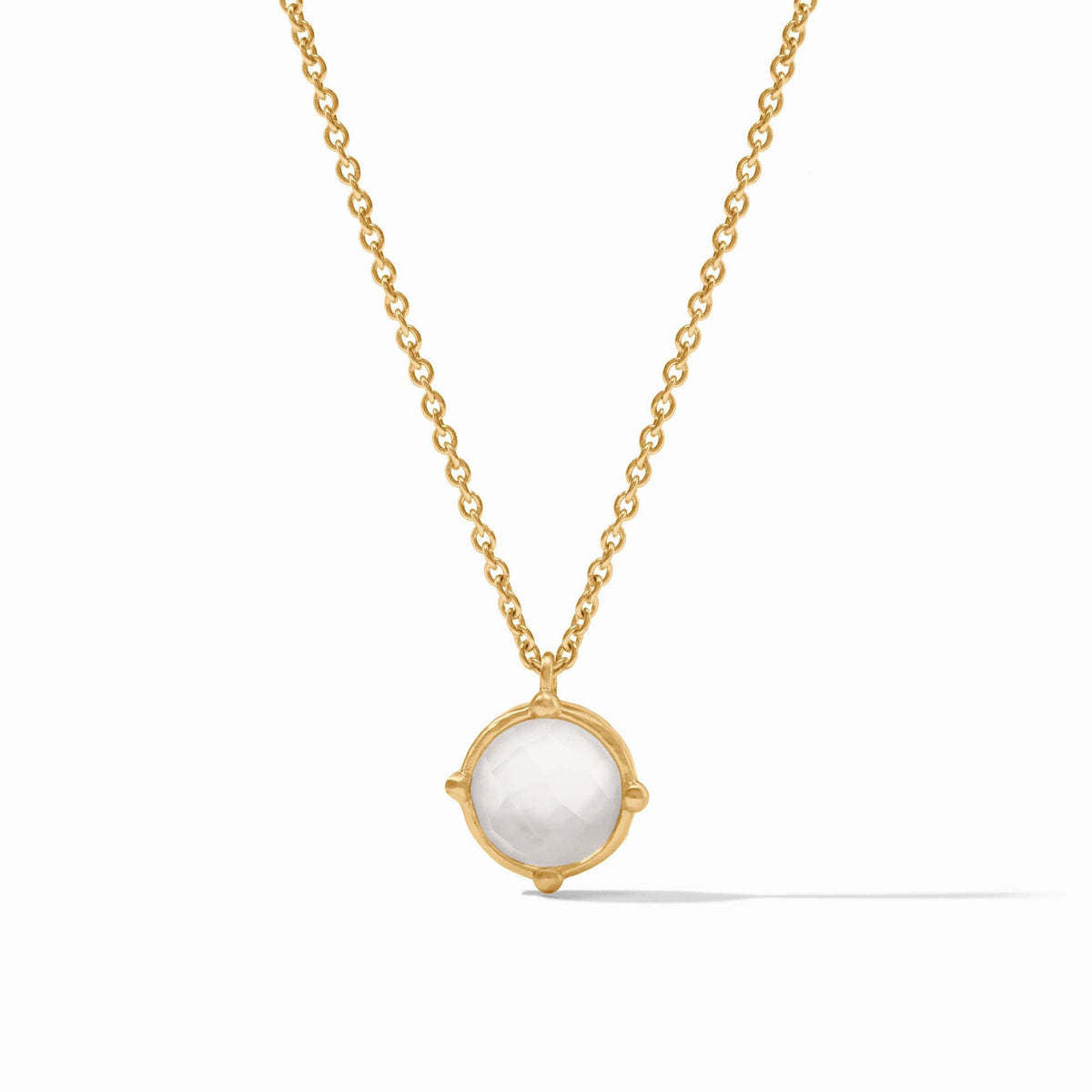 Iridescent clear crystal solitaire necklace with four bead accents on an adjustable cable chain.