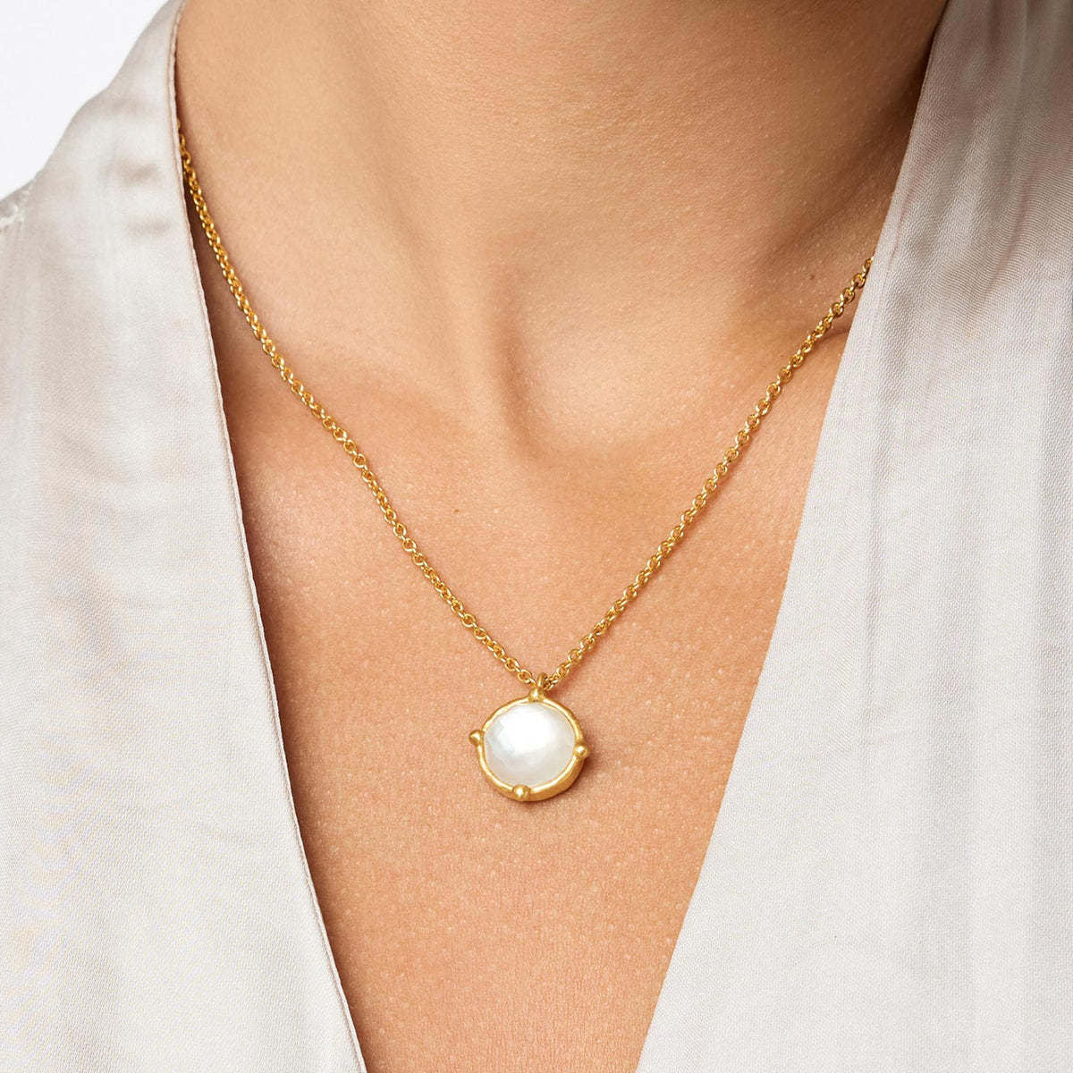Honeybee solitaire necklace featuring a faceted gemstone with four beads on an adjustable cable chain.