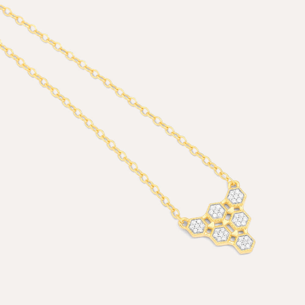 Honeycomb pendant necklace with diamond accents on a gold-plated sterling silver chain.