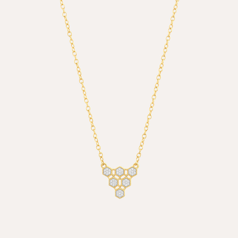 Honeycomb pendant necklace on a chain with gold plating over sterling silver.