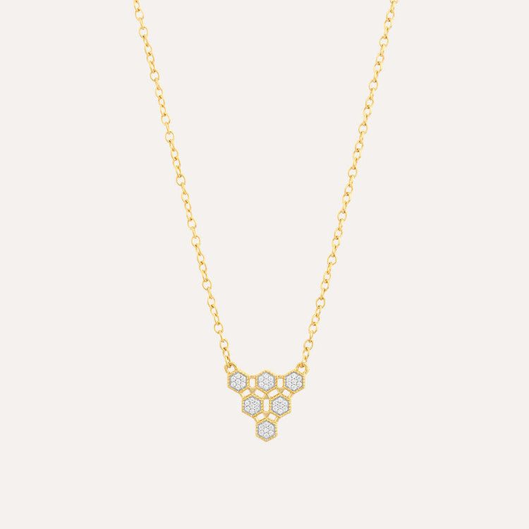 Honeycomb pendant necklace on a chain with gold plating over sterling silver.