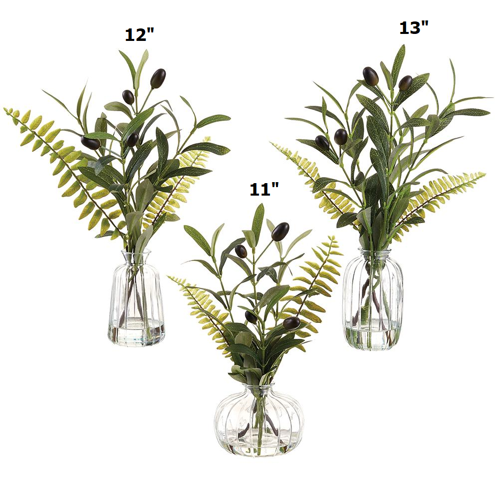 Glass vase with olive green fern-like wire foam structure inside