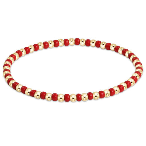 Hope Grateful bracelet featuring mixed red seed beads with gold-filled accents on elastic cord.
