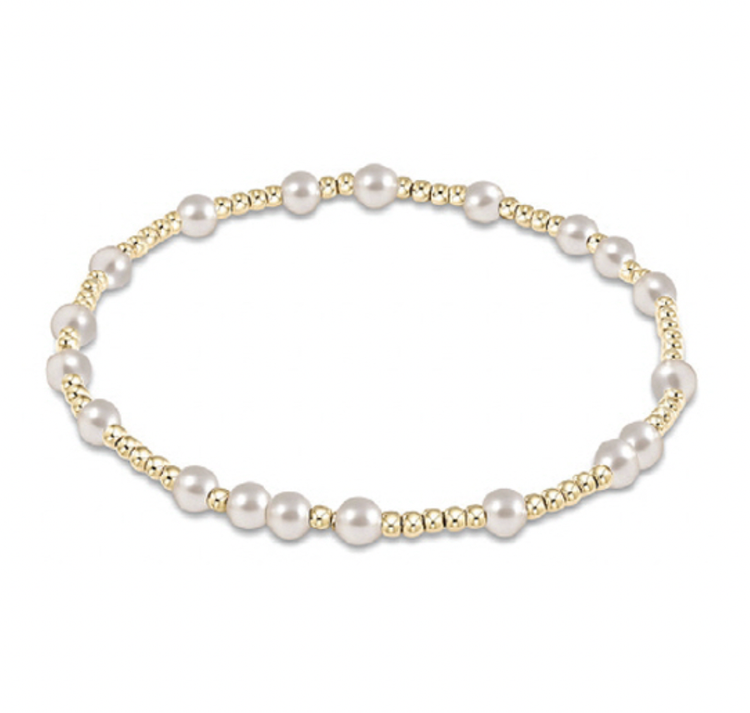 Hope Unwritten bracelet featuring hand-beaded 4mm pearls and 2mm gold-filled beads on elastic cord.