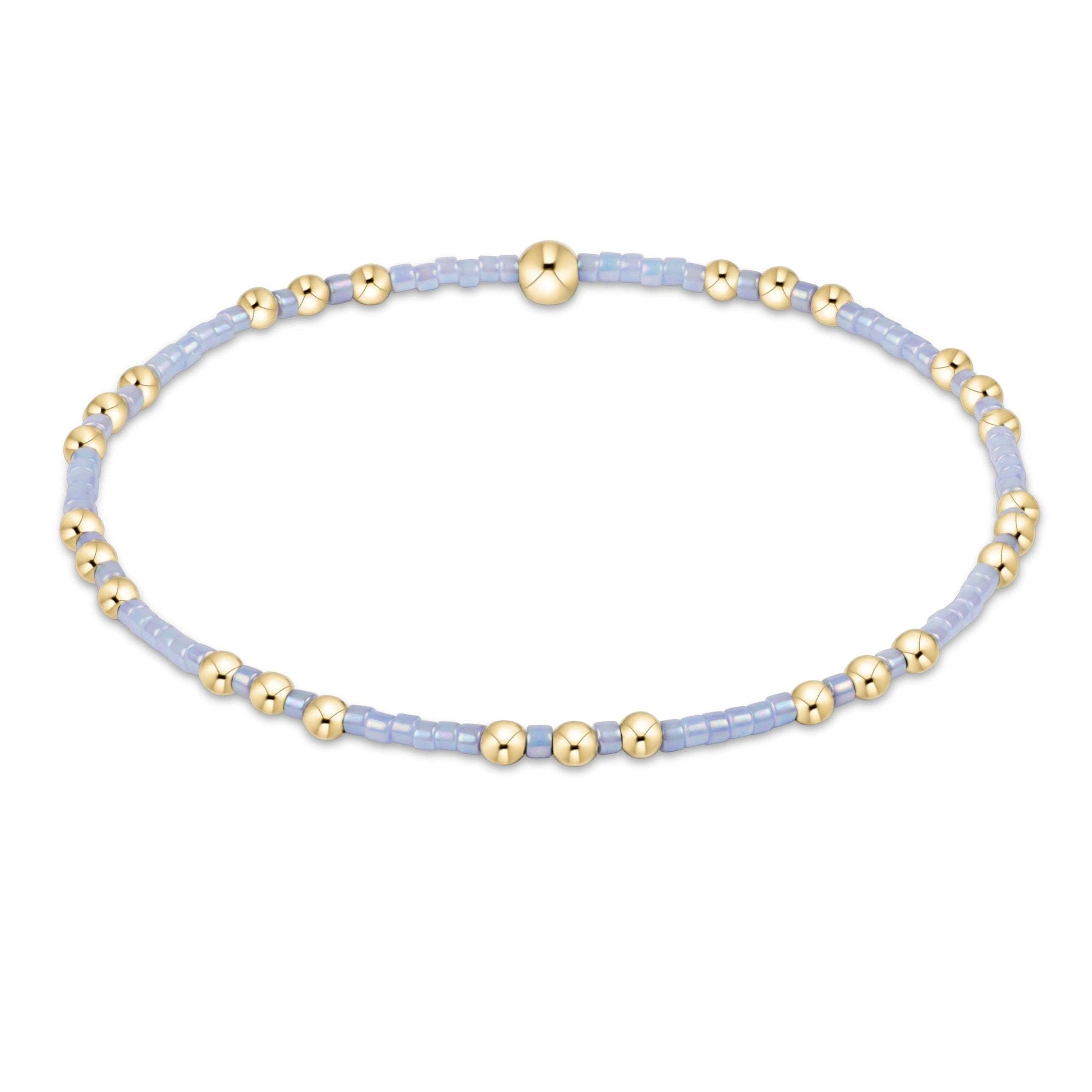Ocean mist seed bead bracelet with gold accents on elastic band