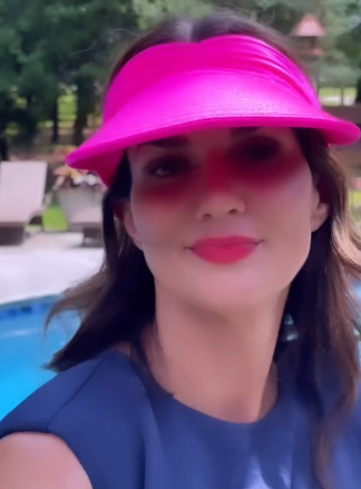 Hot pink chinlon visor hat with wide brim, elastic closure, open top design, and contrasting color pattern.
