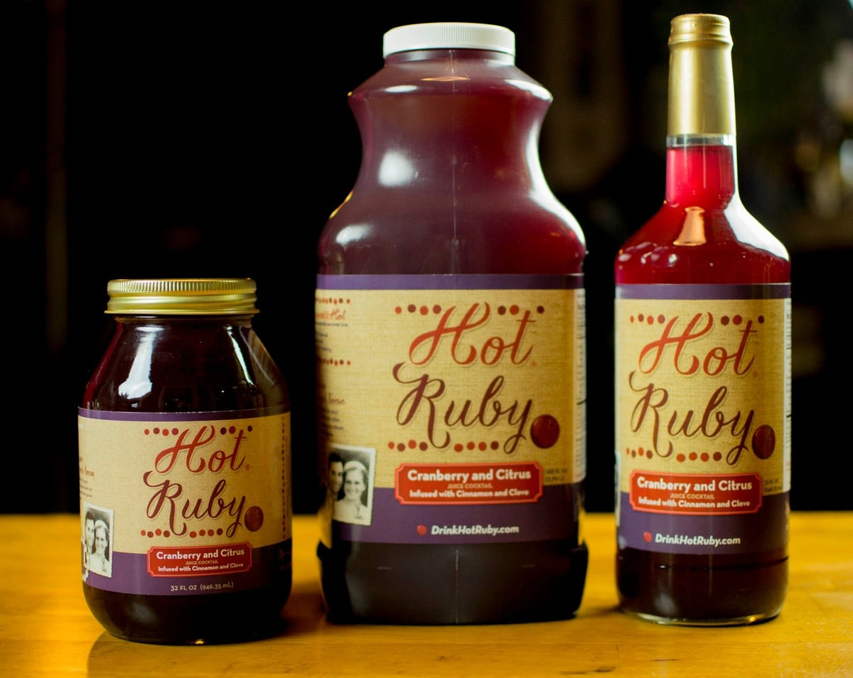 Hot Ruby Gallons bottle with cranberry citrus spice blend label