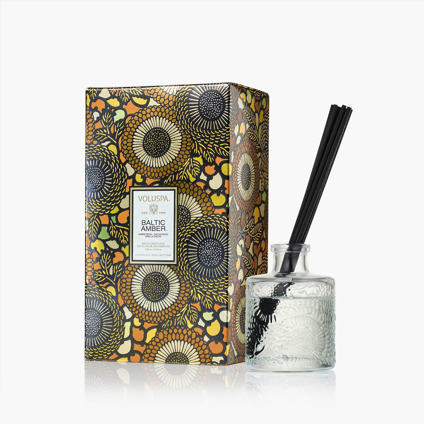 Glass reed diffuser bottle with neutral liquid and wooden sticks