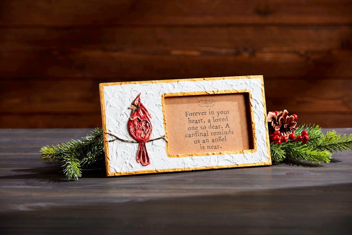 Cardinal Frame: a rectangular wooden frame with a cardinal red finish measuring 5 3/4 by 10 1/2 inches.