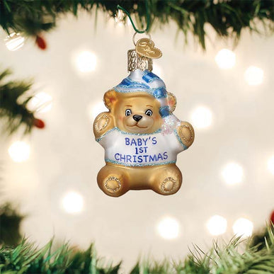 Small brown teddy bear ornament with black button eyes.