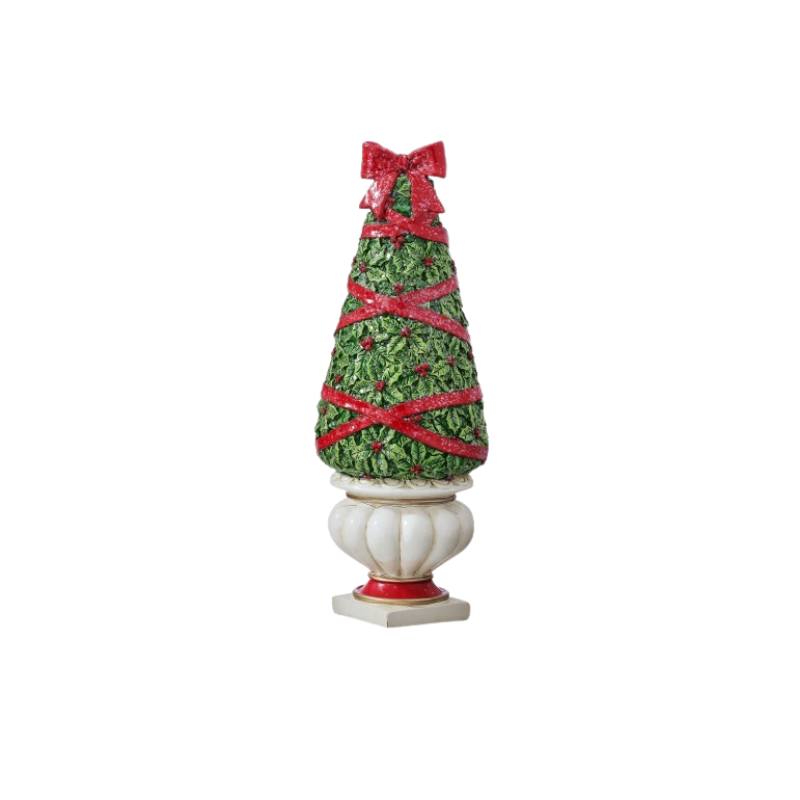 Resin holiday topiary with green holly leaves, red berries, and a red ribbon in a white urn.