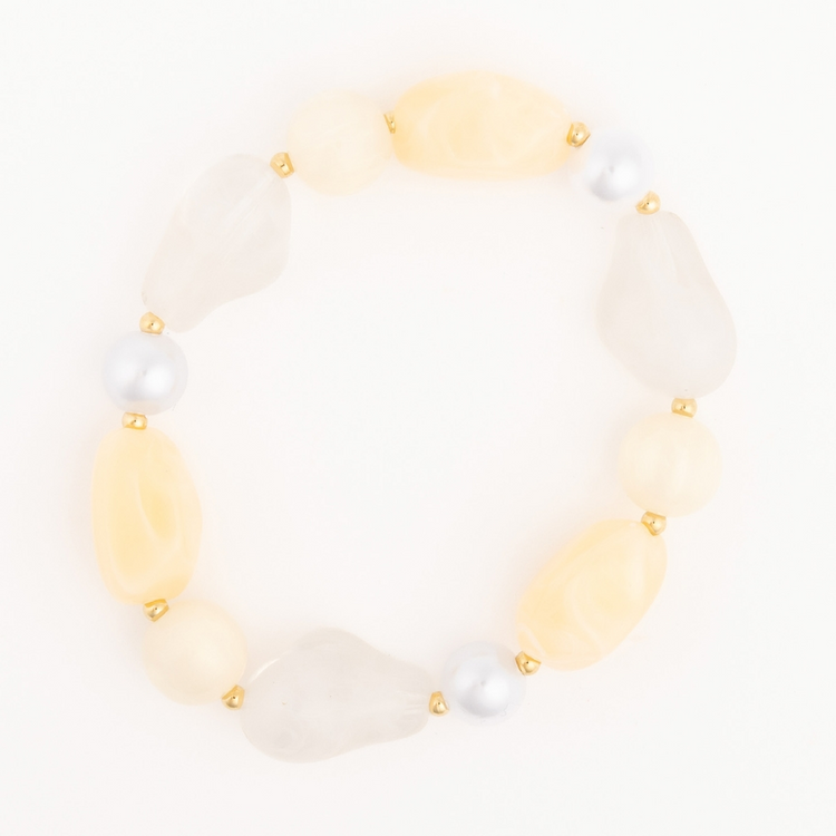 Zoe Bracelet featuring large, irregular pale yellow and white beads with gold-toned spacers.