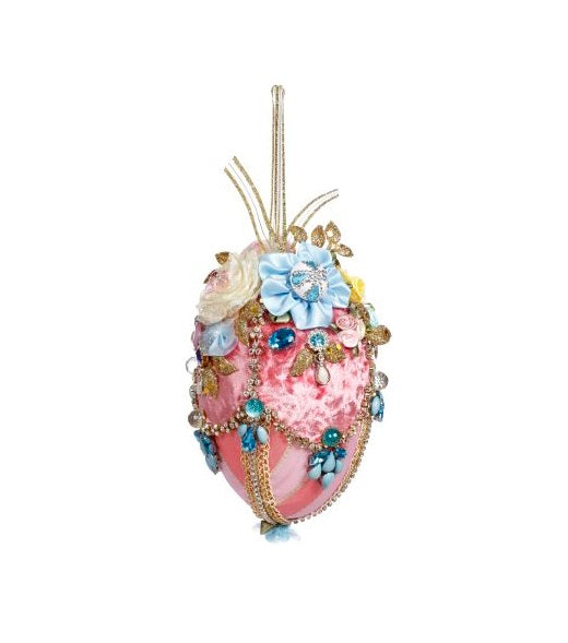 Six-inch foam Easter egg decorated with fabric flowers and jewels on a ribbon hanger.