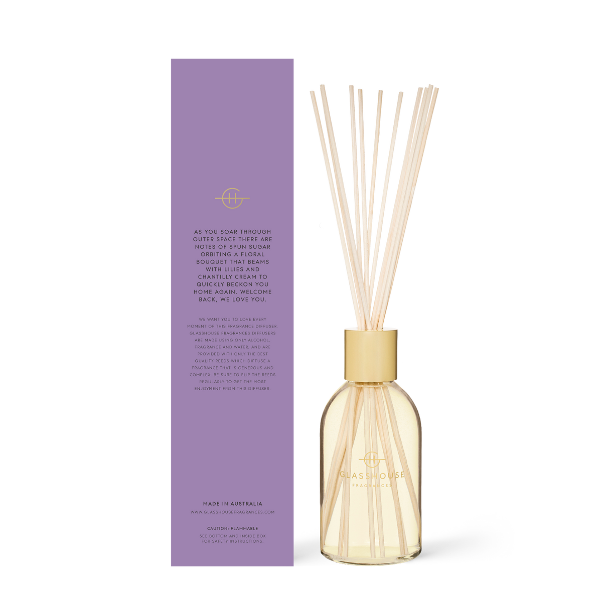 8.4 fl oz Moon And Back diffuser with amber liquid inside a clear glass bottle and wooden reeds.