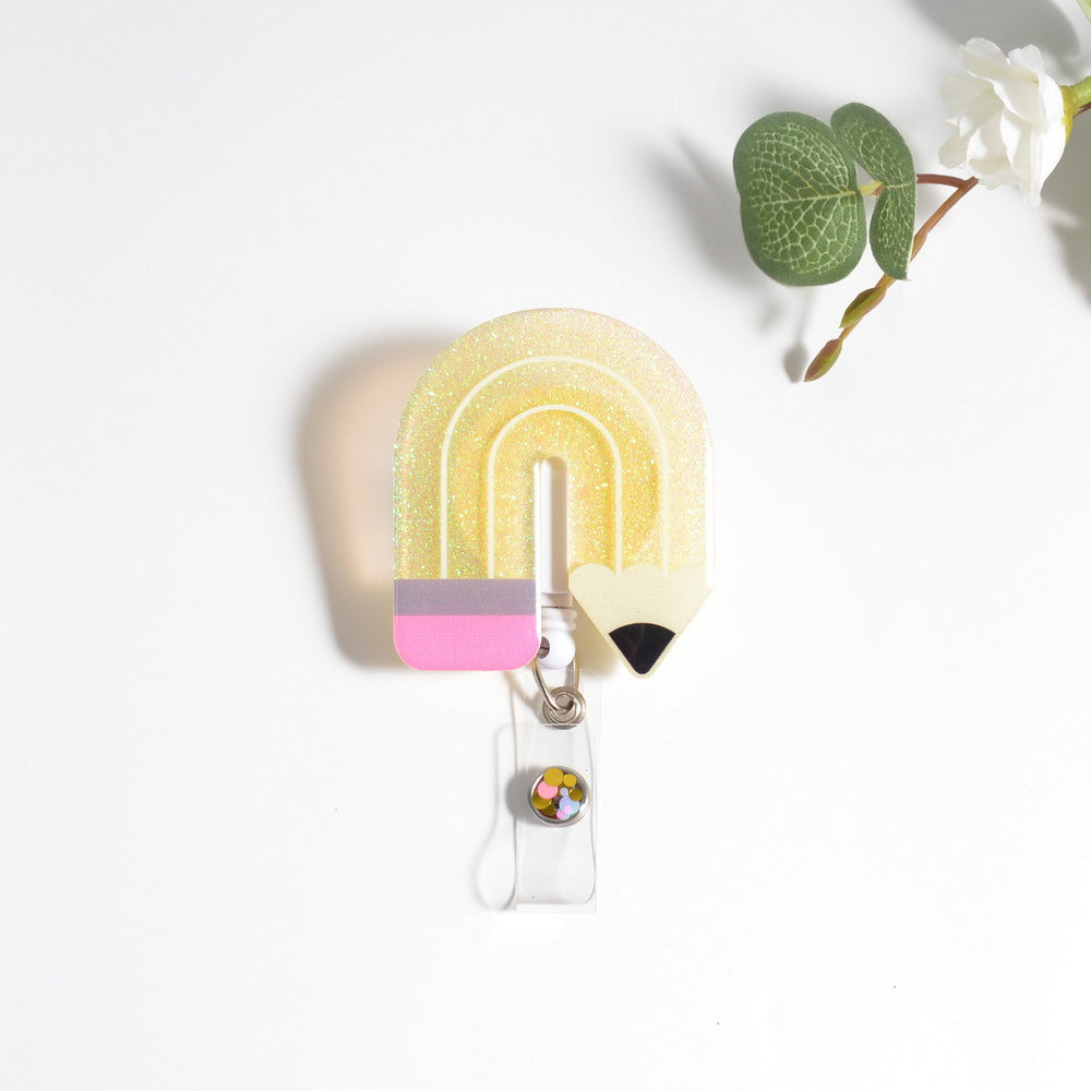Glitterific badge reel with a black alligator clip featuring a sparkly glitter resin heart design.